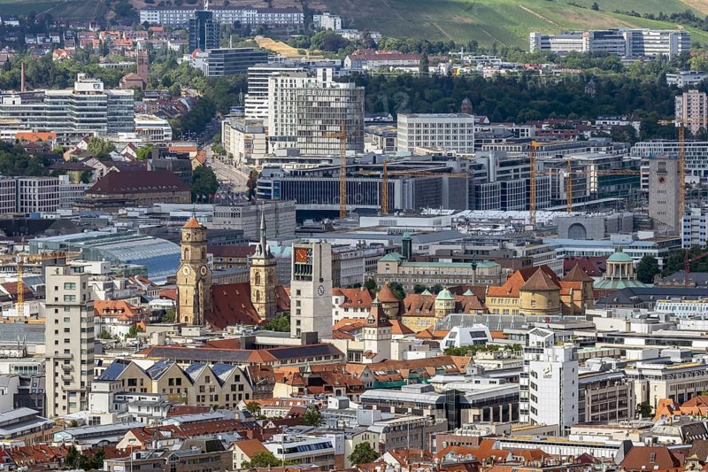 City view of Stuttgart. Overview of the state capital. In the center of the picture, the center with the towers of the collegiate church, town hall tower, old castle. Above that, the construction site at Stuttgart 21. Stuttgart, Baden-Württemberg, Germany