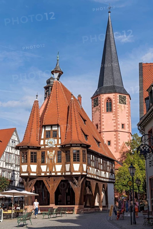 Old town hall, late medieval half-timbered building with oriels, turrets and high pointed roof, Gothic, cultural monument, bell tower of the town church, market square, historic old town, Michelstadt, Odenwald, Hesse, Germany