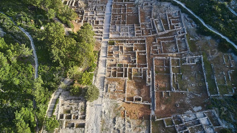 Drone shot, first morning light, Close aerial view of an ancient ruins site, clearly visible walls and ditches amidst green vegetation, Kamiros, Archaeological site, Ancient city, Foundation of Doric Greeks, Rhodes, Dodecanese, Greek Islands, Greece