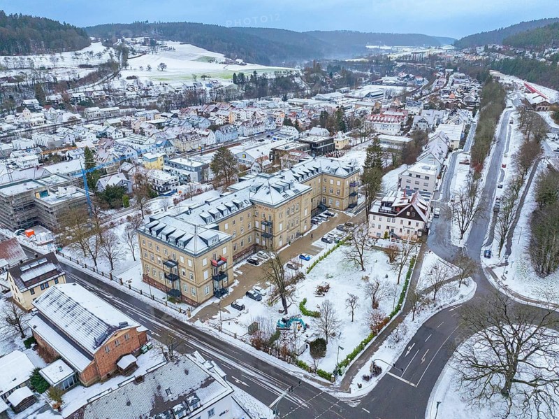 Aerial view of a snow-covered town with surrounding streets and buildings, Nagold, Black Forest, Germany