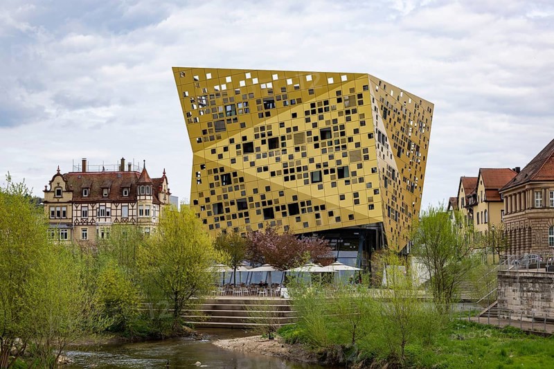 Distinctive building Forum Gold & Silver. The Gold and Silver Forum building, completed in 2014, has become a new landmark in the city as Swiss slate cheese. City view with river Rems of Schwäbisch Gmünd, Baden-Württemberg, Germany