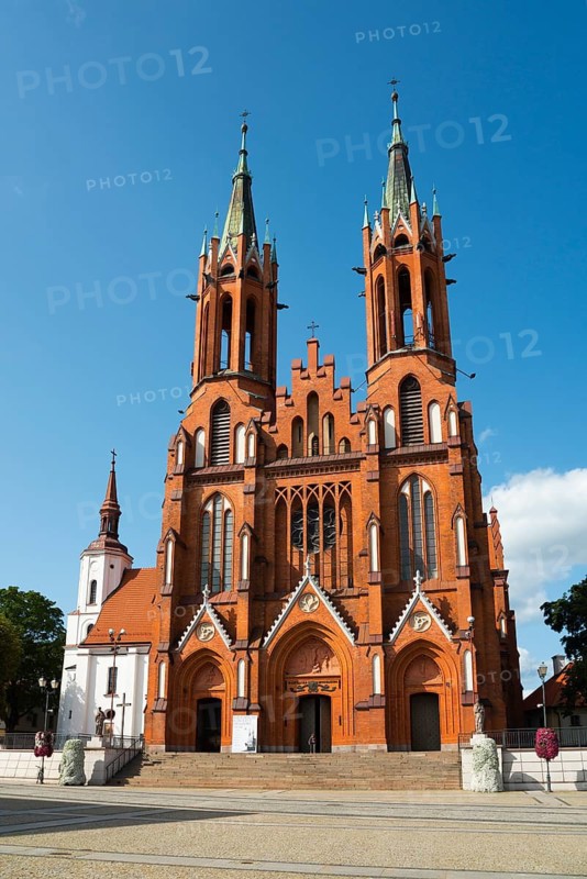 Large, red brick church with two high towers under a clear sky, Church of the Blessed Virgin Mary, Bialystok, Bialystok, Bjelostock, Podlaskie, Poland