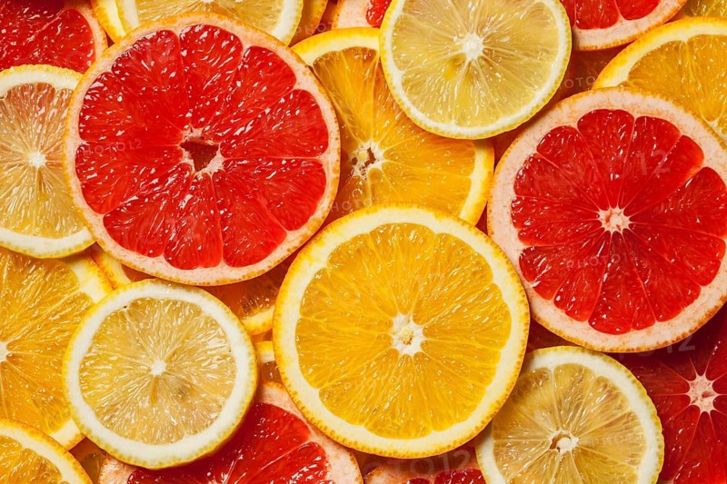 Colorful citrus fruit, lemon, orange, grapefruit, slices background