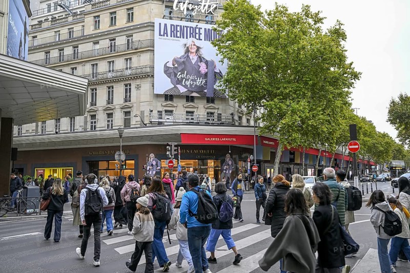 Passers-by in front of Galeries Lafayette, France's most famous department store, Boulevard Haussmann, 9th arrondissement, Paris, Île-de-France region, France