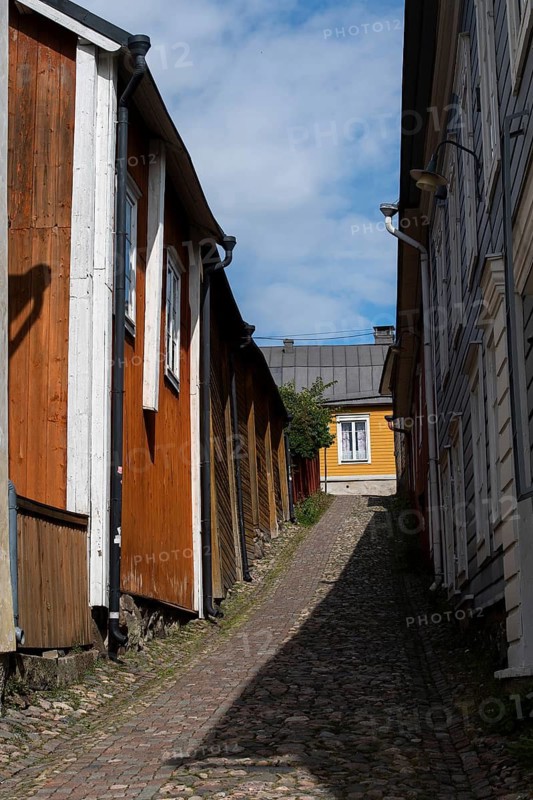 Alley with cobblestones and old wooden houses, Borgå, Porvoo, Finland