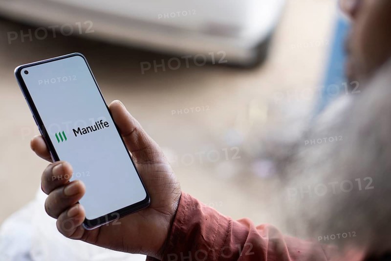 Manulife logo is displayed on smartphone. Manulife Financial Corporatipon is a Canadian multinational insurance company