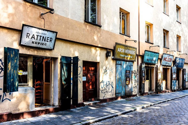 Shop fronts on Szeroka Street, signs bearing Polish and Jewish names, Kazimierz, a historically significant, formerly independent district that has developed into an important center of Jewish culture since the 14th century, Krakow, Poland