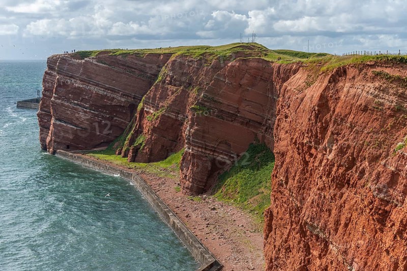 Red coloured sandstone, steep cliff coast of the offshore island of Heligoland, home of the gannets, Helgoländer Oberland, North Sea, Pinneberg district, Schleswig-Holstein, Germany