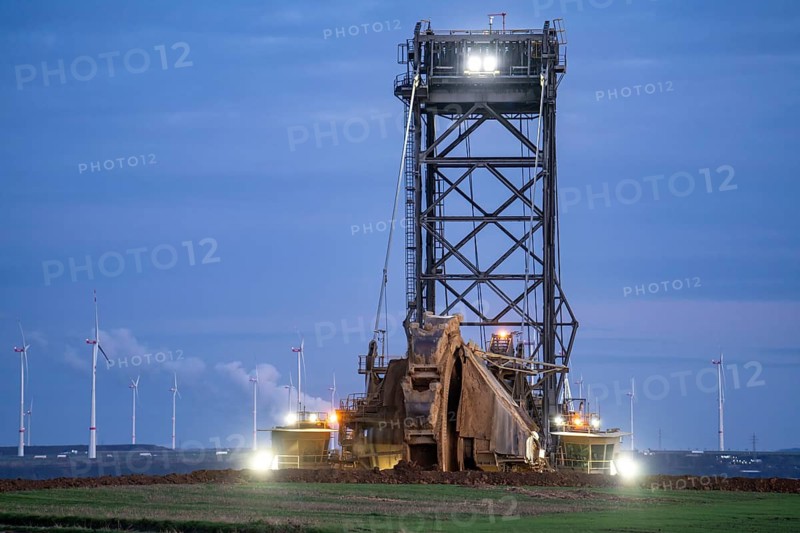 Edge of the Garzweiler II open-cast lignite mine, at the village of Lützerath, the last village to be excavated, in the background wind farm at Neurath power station, belongs to Erkelenz in the district of Heinsberg, North Rhine-Westphalia, Germany