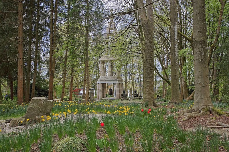 Stupa with garden art and flowers in spring, Buddhist Center, EIAB, Waldbröl, Bergisches Land, North Rhine-Westphalia, Germany