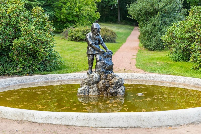 Dwarf fountain figure in Naundorf Castle Park, Dippoldiswalde, Saxony, Germany