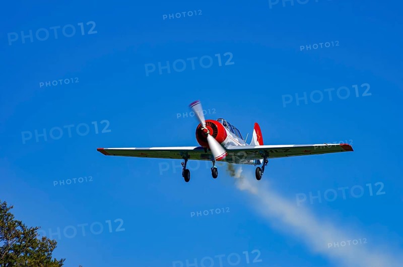A Jakovlev Jak-52 with registration LY-HLZ during a flight demonstration as part of an air show on Rossfeld in Metzingen-Glems, Baden-Württemberg, Germany, for editorial use only