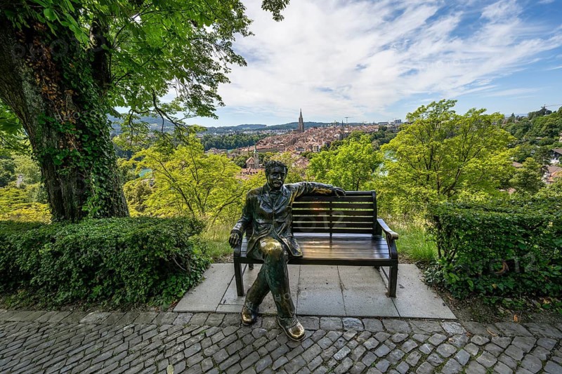Albert Einstein sitting on a bench, bronze figure of Le Passioni, view of the old town from the rose garden, Berner Münster, Nydegg district, Bern, Canton of Bern, Switzerland