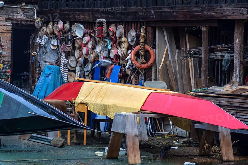 Gondolier straw hats on a wooden wall of a shipyard, Venice, Veneto, Italy