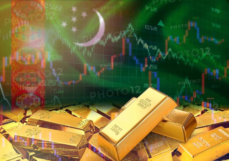 Gold bars on Turkmenistani flag in background. Gold bars stacked on Turkmenistani flag. Concept of Turkmenistan gold reserves