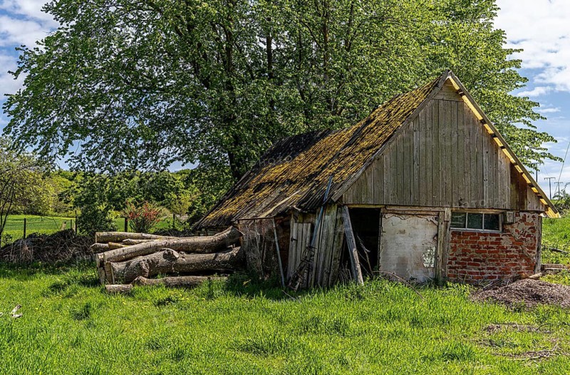 Abandoned and derelict farmhouses on undeveloped land in Rügen, Mecklenburg-Vorpommern, Germany