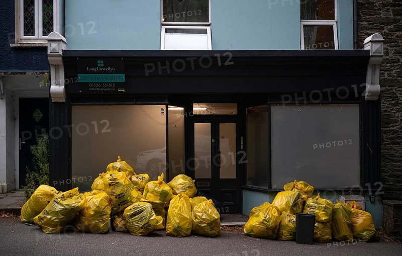 Yellow trash bags from the recycling company Cornwall Waste Care are ready for collection, Falmouth, Cornwall, England, Great Britain, Great Britain
