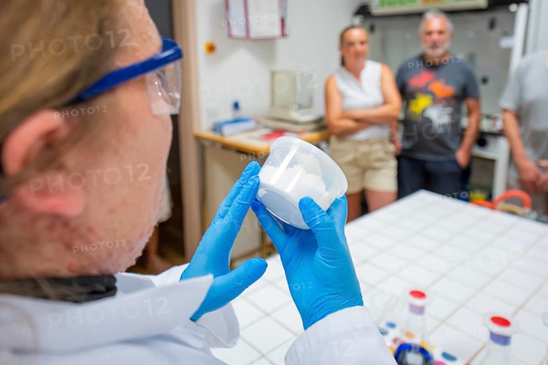 A scientist explains something in a laboratory, viewers watch with interest, Youth Research Center, Nagold, Germany