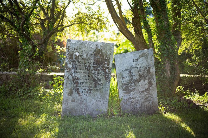 Tombstones, graves, trees, flooded with light, cemetery, parish church, St Just in Penwith, Cornwall, England, Great Britain, Great Britain