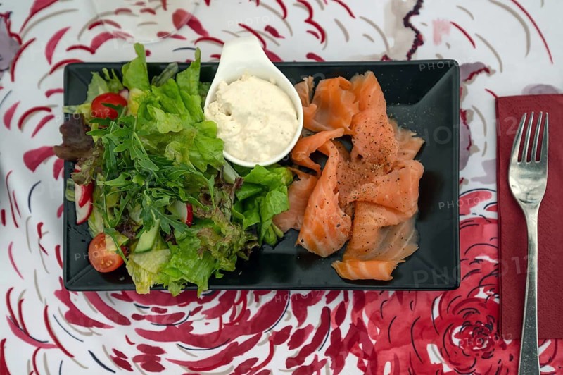 Salmon fillet served with salad and cream merettich in a garden restaurant, Franconia, Bavaria, Germany