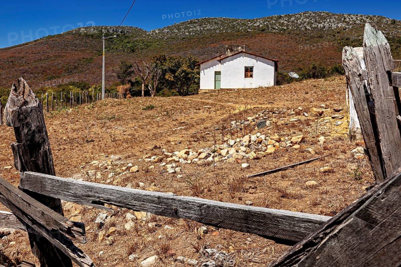Lonely hut on a hill in a deserted and arid landscape, settlement and villages in the Caatinga of Pernambuco and Bahia in Brazil