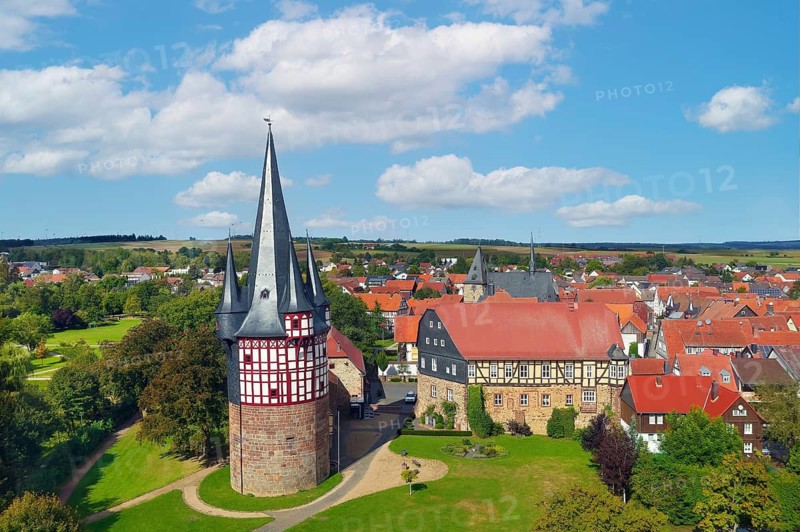 Aerial view, Junker Hansen Tower, fortified defence tower, residential tower, largest half-timbered round building in the world, height 51 metres, built in 1480, landmark of the town of Neustadt, to the right of Dörnberg Castle, late Gothic, built at the end of the 15th century, district of Marburg-Biedenkopf, Hesse, Germany