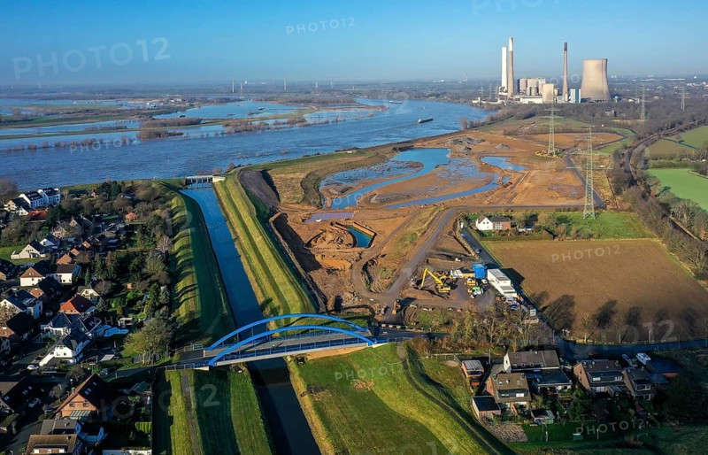 Dinslaken, North Rhine-Westphalia, Germany, Emscher estuary into the Rhine. On the right, the construction site of the new Emscher estuary in front of the decommissioned STEAG coal-fired power plant in Voerde. The mouth of the Emscher into the Rhine is being moved almost 500 metres north from Dinslaken to Voerde. Fish will then be able to swim barrier-free up the new Emscher from the Rhine through a newly created floodplain area. Following the construction of a parallel sewer, the Emscher has been completely free of sewage since January 2022. The river was previously an open, above-ground combined sewer with rainwater and wastewater