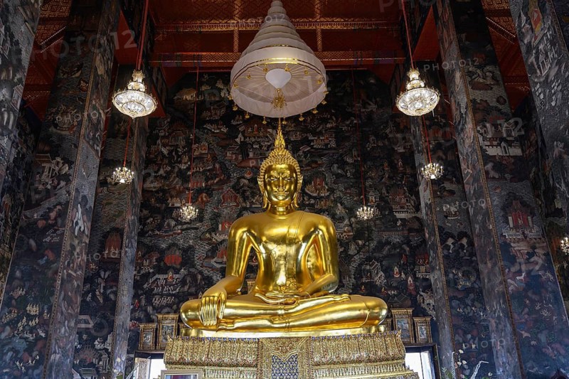 Bangkok, Thailand. February 20th 2025. Beautiful view of gilded Buddha statue among amazing murals in Wat Suthat Thepwararam. The Buddhist temple is a popular tourist attraction of Thailand