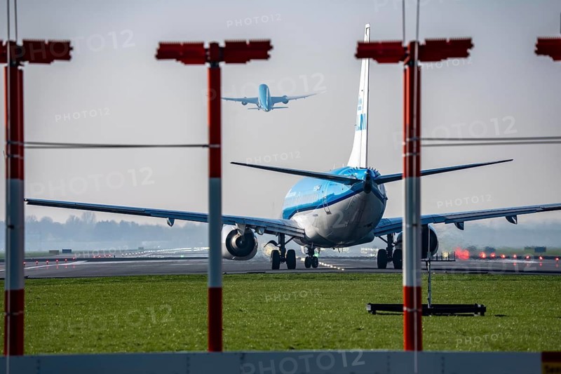 Amsterdam Schiphol Airport, Aalsmeerbaan runway, 18L-36R, KLMflieger on the runway, waiting for take-off, other aircraft taking off, Netherlands