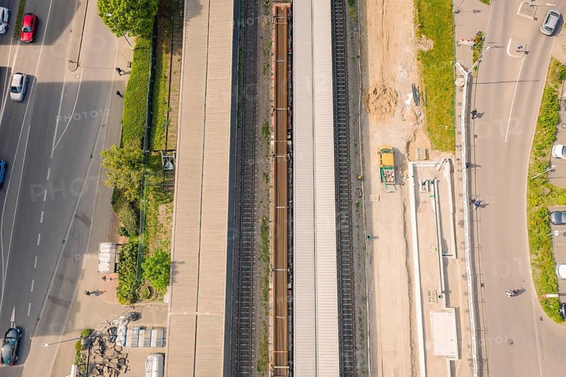 Aerial view of a railway system with rails and roads running next to them, construction site by Leonhard Weiss for the renovation of the station and construction of the overhead line, Waldshut, Germany
