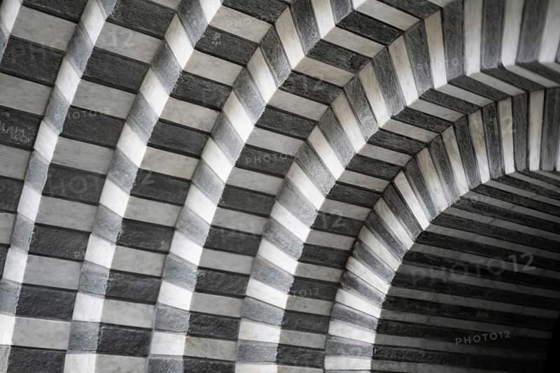 Marble and gneiss alternating in layers, round arch approach, interior, Roman Catholic church of San Giovanni Battista, built in the same place as the village church destroyed by avalanche in 1986, architect Mario Botta, Mogno, Maggia Valley, Valle Maggia, municipality of Lavizzara, Canton of Tessin, Switzerland
