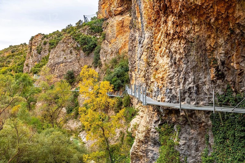 Metal walkways on the wall of the path next to the Vero River in Alquezar. Pyrenees