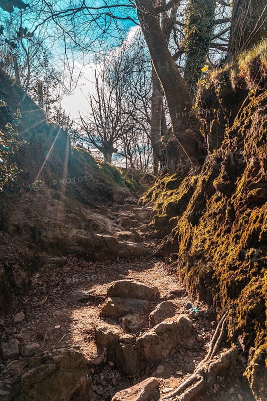 Mud ramps on the trail of Mount Adarra in Guipuzcoa with sunshine above. Basque Country