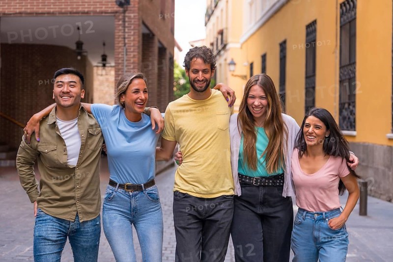Multiracial best friends having fun in the city, friendship concept with guys and girls hanging out on the city street