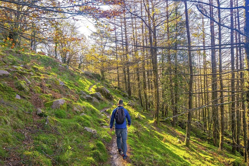 A young hiker heading to the summit of Mount Adarra in Urnieta, near San Sebastian. Gipuzkoa, Basque Country