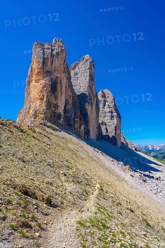 Scenic view of the tre cime di lavaredo mountain peaks with hiking trail in the dolomites, italy
