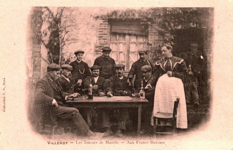 Players of manille card game