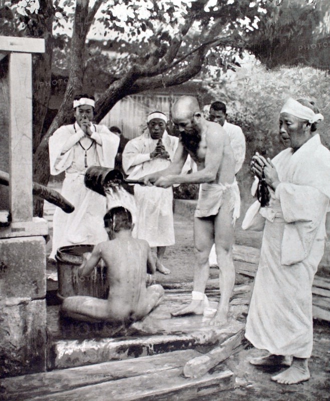 During the death throes of Japanese Emperor Yoshi-Hito, representatives of a Buddhist sect proceding with  purification ceremonies before participating in prayers for the sovereign (1927)