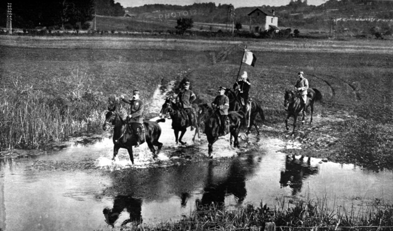 World War I. On an inspection tour in Alsace, General Dubail fords a river (1915)