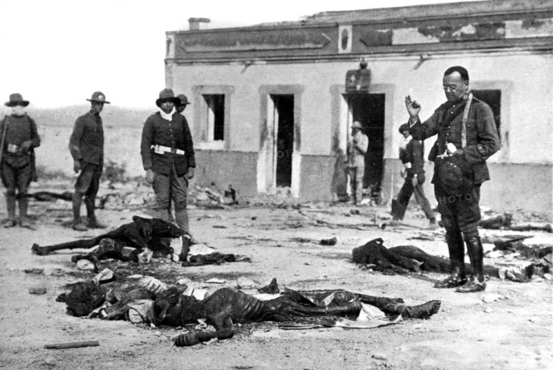 Morocco, Rif War. A military chaplain blessing the bodies of soldiers massacred on site by Moroccans (1921)