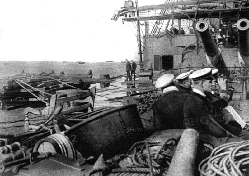 World War I. At the entrance to the Dardanelles, an English battleship, ready for combat, in the line of  mine-sweepers off Seddul-Bahr