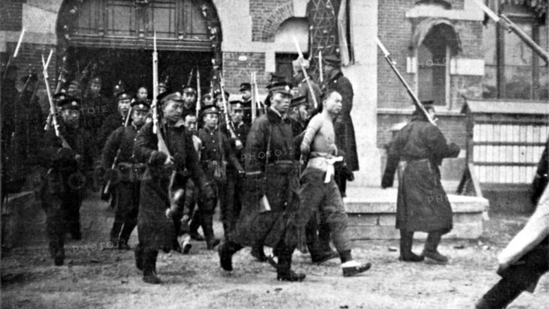 After the Peking riots, Chinese coolies about to be beheaded, February 1912.