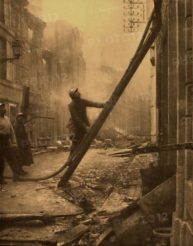 World War I. 
In Verdun, firemen fighting fires started by incendiary shells (1916)