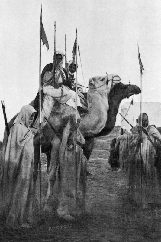 Arab soldiers in Libya, holding spears stolen to the Italians