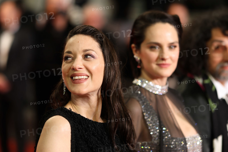 Noémie Merlant (in custom Louis Vuitton) and Marion Cotillard (in custom Chanel) attend the "Roma Elastica" screening during the 79th annual Cannes Film Festival at Palais des Festivals on May 20, 2026 in Cannes, France.