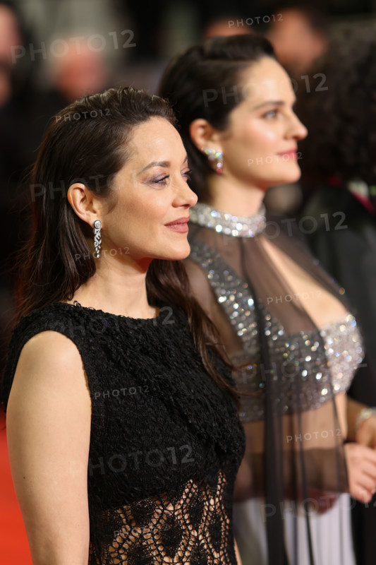 Noémie Merlant (in custom Louis Vuitton) and Marion Cotillard (in custom Chanel) attend the "Roma Elastica" screening during the 79th annual Cannes Film Festival at Palais des Festivals on May 20, 2026 in Cannes, France.