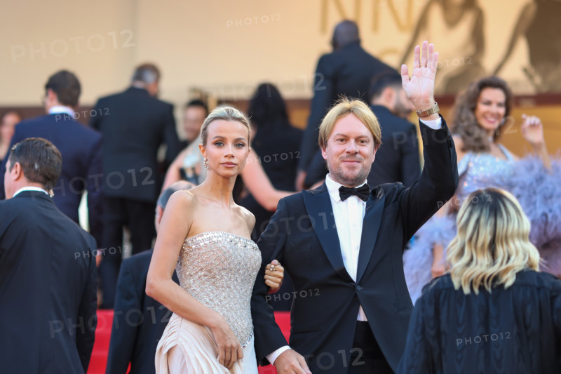 Simona Jakstaite (in Georges Hobeika) and Christopher Aleo attend the "Histoires De La Nuit" (The Birthday Party) screening during the 79th annual Cannes Film Festival at Palais des Festivals on May 22, 2026 in Cannes, France.