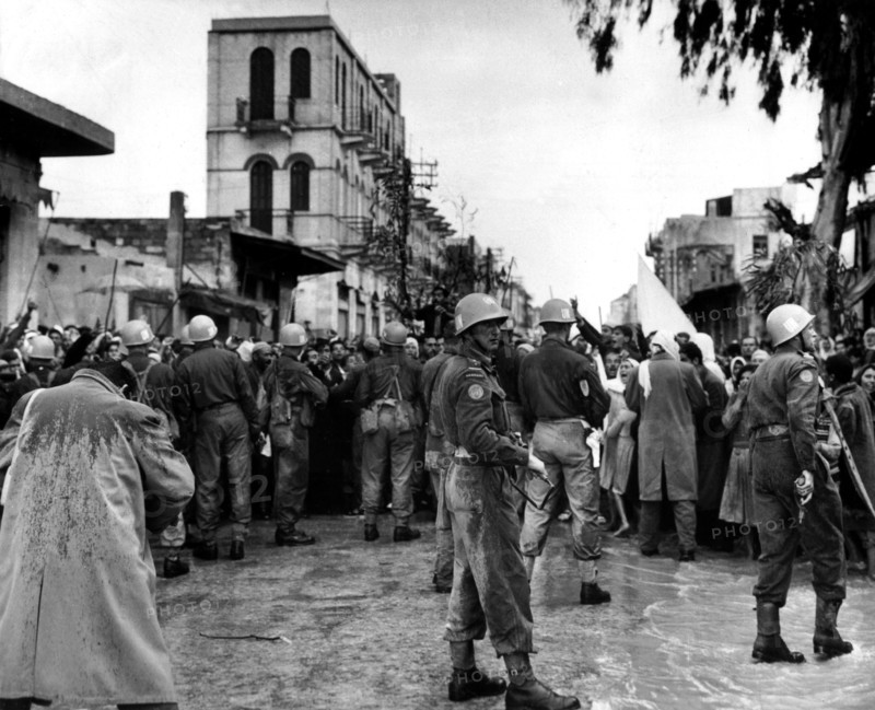 Soldiers of The United Nations Emergency Force retaining demonstrators in Gaza, 1957