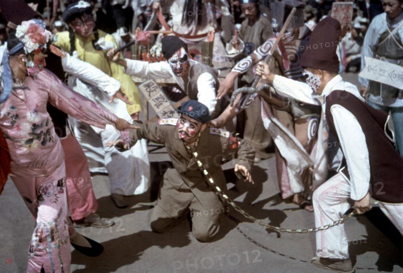 Masquerade. Stalin sentenced to death by two evil spirits because of the crimes he has committed against China