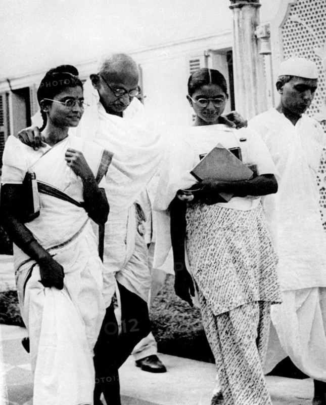 Gandhi surrounded by his daughters